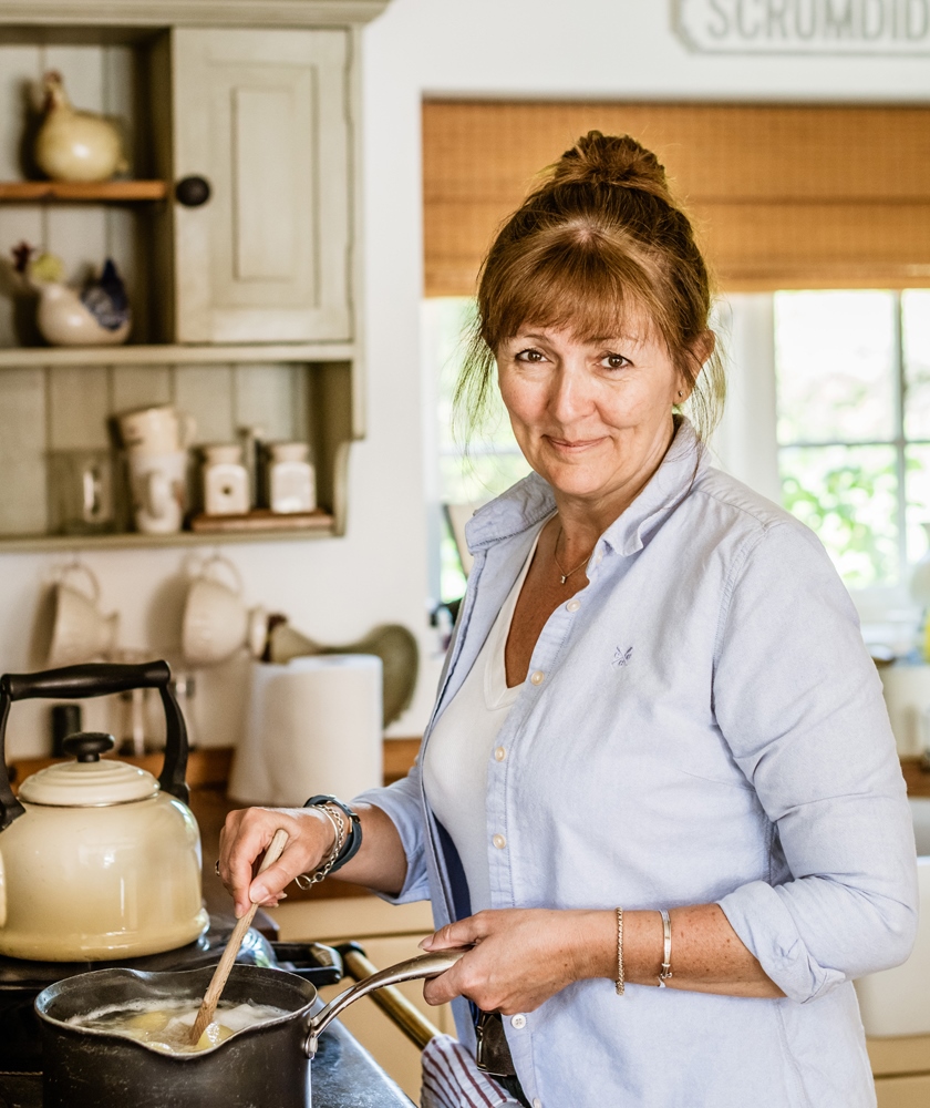 Tapestry Day Club dementia care host from Tisman's Common Sussex cooking in her kitchen