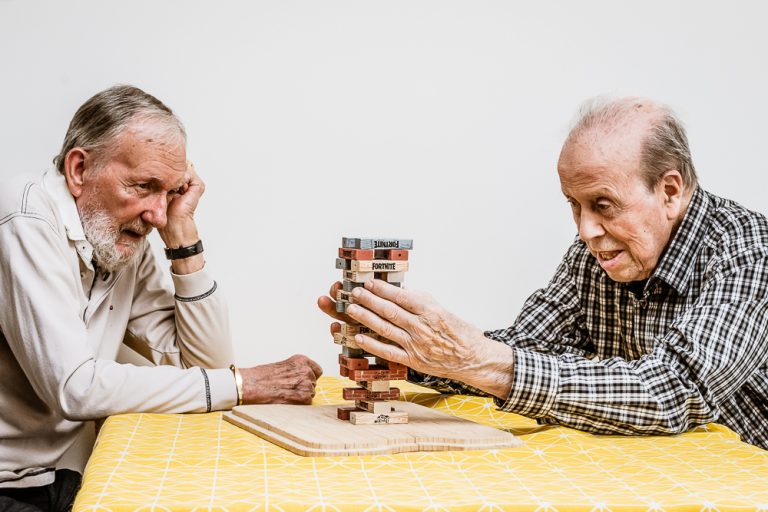Two Tapestry Dsy Care Dementia Day Care charity guests playing Jenga